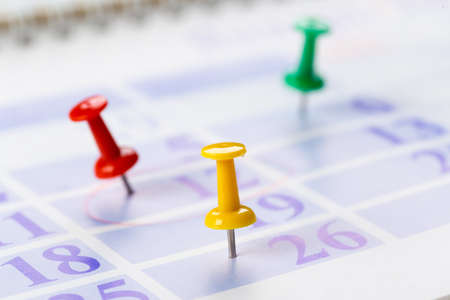 Push pins on calendar. Idea concept of to do planning.の写真素材