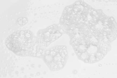 Abstract background white soapy foam texture. Shampoo foam with bubbles