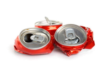 Compressed aluminum red cans isolated on white background