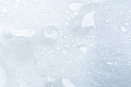 Background of soap foam and bubbles on a white background, macro photographyの写真素材