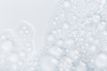 Foam bubble from soap or shampoo for washing isolated on white background from aboveの写真素材