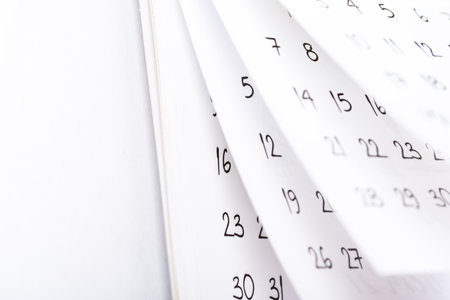 Abstract blur calendar for month schedule to make an appointment or manage the schedule every day pages flipping close backgroundの写真素材