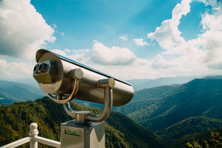 Binoculars with coin acceptor looking at beautiful mountainsの写真素材