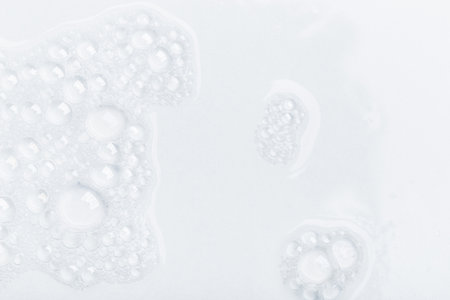 Foam bubble from soap or shampoo for washing isolated on white background from aboveの写真素材