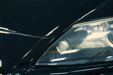 close-up of front xenon turning headlights of modern car in garage