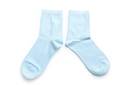 a pair of colored new socks made of fine knitwear isolated on a white background.の写真素材