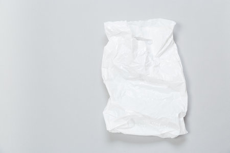 disposable plastic bag on gray background. Space for your textの写真素材