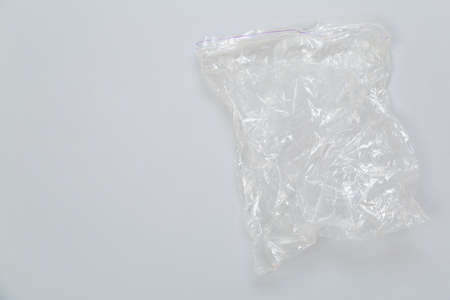 disposable plastic bag on gray background. Space for your textの写真素材
