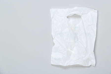 disposable plastic bag on gray background. Space for your textの写真素材