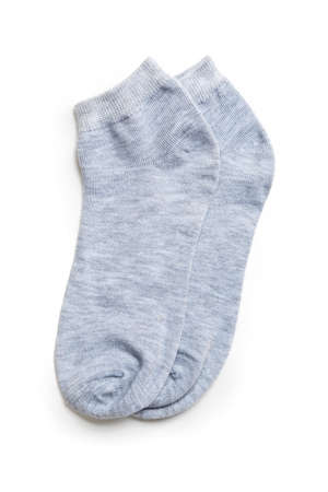 a pair of colored new socks made of fine knitwear isolated on a white background.