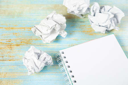 Paper balls and pen over blank white sheet - Creativity crisis concept