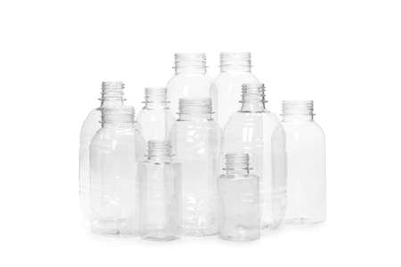 many different empty plastic bottles isolated on white background. production of new containersの写真素材
