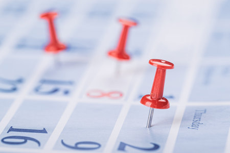 Calendar page for 2021 marked with an important date with a lot of pin. chronology, time, concept,...