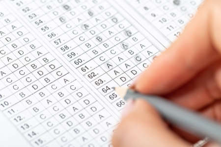 The student fills in the answers to the test in the exercise and examination paper with a pencil....