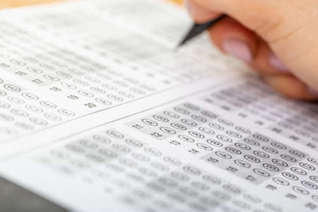 The student fills in the answers to the test in the exercise and examination paper with a pencil....