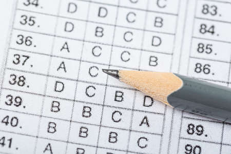 testing in exercise and exam paper. computer sheet with pencil in school test room, education...