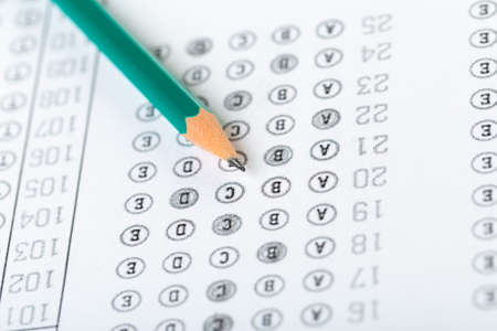 testing in exercise and exam paper. computer sheet with pencil in school test room, education...