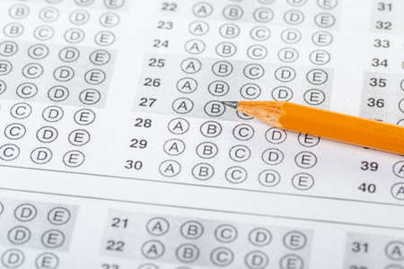 testing in exercise and exam paper. computer sheet with pencil in school test room, education...