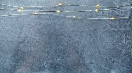 The garland is on. Glowing electric garland on a dark background. view top place for textの写真素材