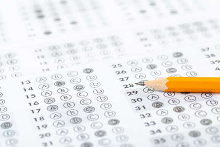 testing in exercise and exam paper. computer sheet with pencil in school test room, education...