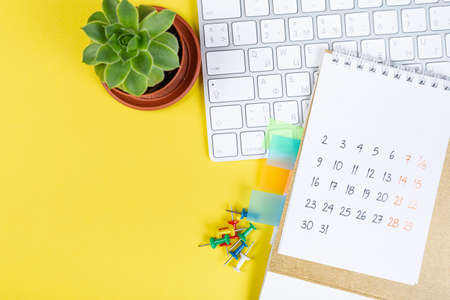 White blank 2021 calendar on solid yellow background with copy space, business meeting schedule, travel planning or project stage and reminder concept.の写真素材