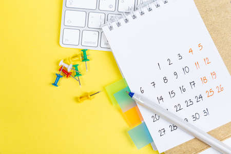 White blank 2021 calendar on solid yellow background with copy space, business meeting schedule,...