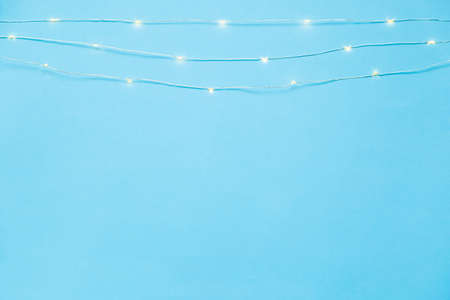 The garland is on. Glowing electric garland on a light blue background. top viewの写真素材
