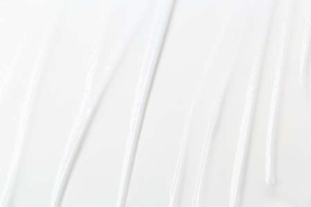 White Cosmetic Cream Isolated on White Background. Lipstick Smear.