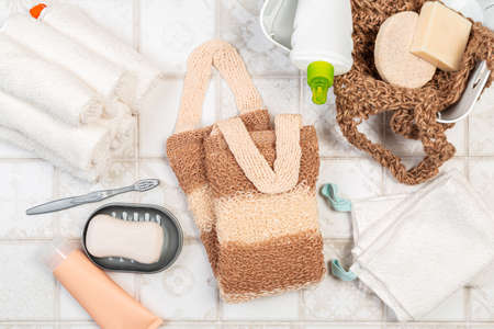 bath sponges for the body, soap and towels on a light background. eco-friendly natural bathroom...