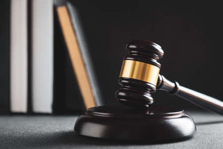 Law and justice. Wooden judge gavel, close-up view.