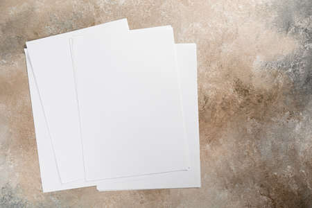 Blank flyer poster a4 or a5 paper isolated on grunge, place for your mock-up designの写真素材