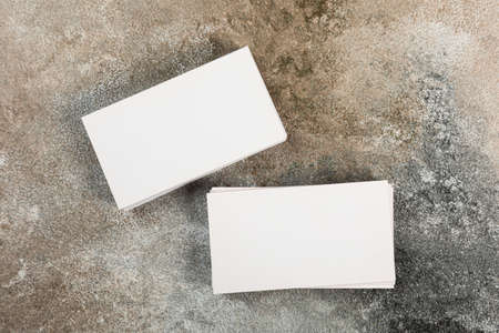 stack of business cards blank mockup on grunge background mocap for design