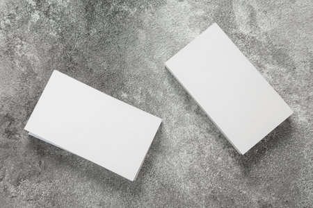 Photo of a stack of blank business cards on a stone table. Template for identity card.の写真素材