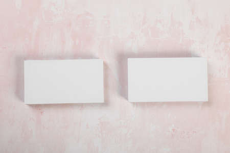 Business cards blank mockup on pink marble background mockup for design