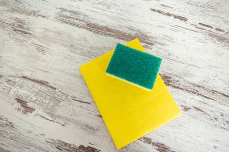 colored rags and sponges for cleaning various surfaces in the kitchen, bathroom and other areas of the cleaning concept.の写真素材