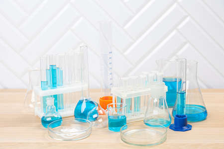 Laboratory glassware with test tubes. flasks, dropper, petri dishes, measuring cups and cylinders...