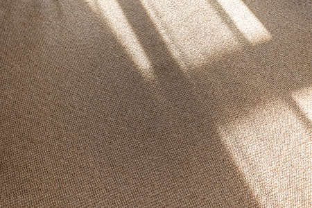 Close-up of a light pile carpet on the floor tiles in the living room, interior decorationの写真素材