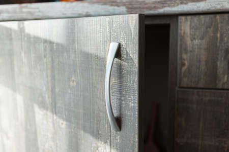 kitchen cabinet with metal handles in the kitchenの写真素材