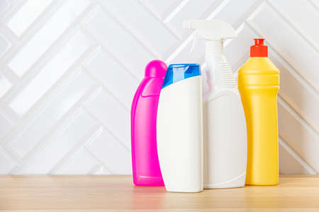 Cleaning bottles for different surfaces in kitchen, bathroom and other rooms. close up. top view. wide banner. Empty place for textの写真素材