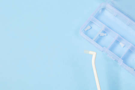 orthodontic toothbrush with one bundle for braces on a blue backgroundの写真素材