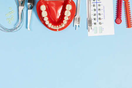 a set of special tools for an orthodontist to install braces for a patient. Orthodontic arcs,...