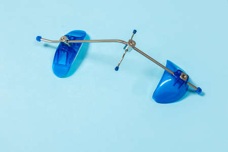 Orthodontic face mask Dental Petite Mask on a blue background special equipment for the dentist
