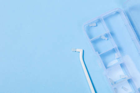 orthodontic toothbrush with one bundle for braces on a blue background