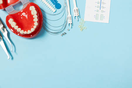 a set of special tools for an orthodontist to install braces for a patient. Orthodontic arcs,...