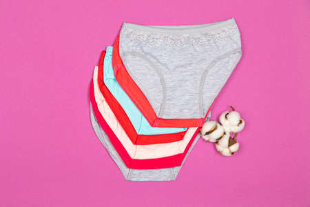 Clothes for children in the form of panties. Clothes for children from soft fabric. panties for girls. A set of panties for children. view from above. Set of underwear. lingerie set.の写真素材