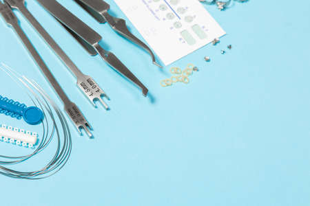 a set of special tools for an orthodontist to install braces for a patient. Orthodontic arcs,...