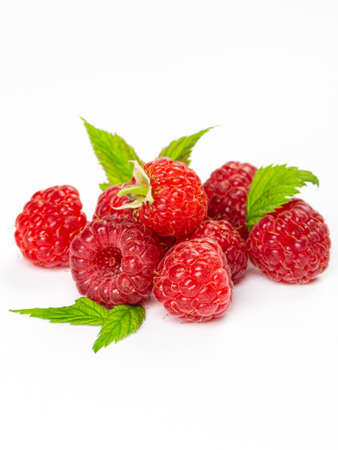 Ripe raspberries with leaf isolated on a white backgroundの写真素材