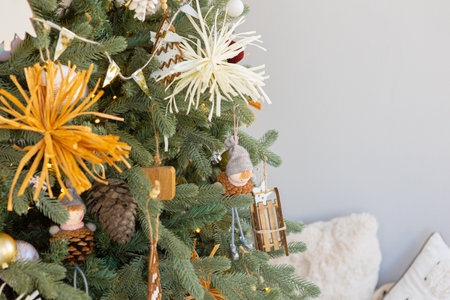 Christmas tree decorated with golden ball toys on a blurry, sparkling and fabulous fairy tale...