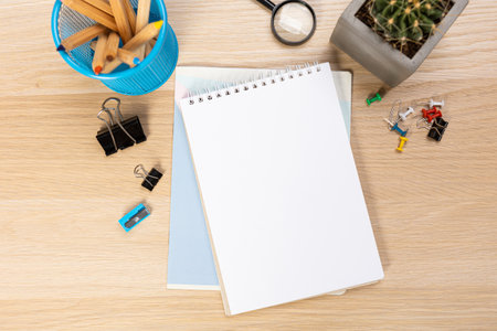 Back to school concept. Top view photo of notepads, pens, sharpeners, ruler, staplers, clips,...