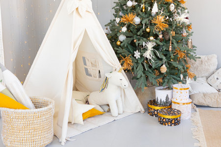 Christmas tree decorated with golden ball toys on a blurry, sparkling and fabulous fairy tale...